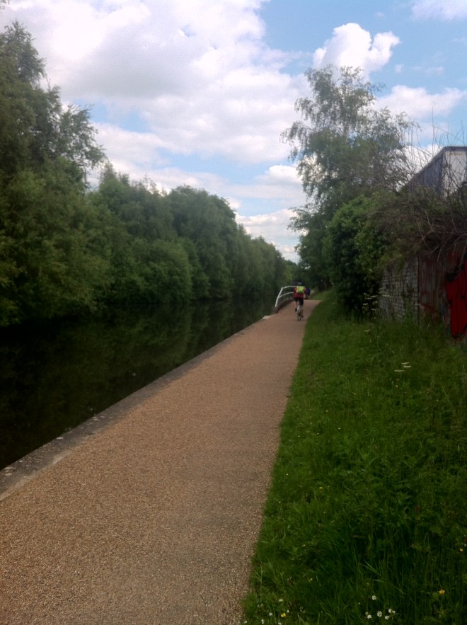 A person on there bike in the distance.